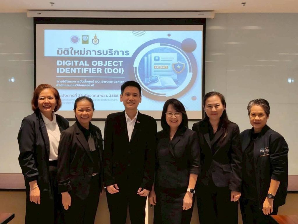 Six people in dark business attire pose in front of a projection screen announcing a session on Digital Object Identifier (DOI) services.